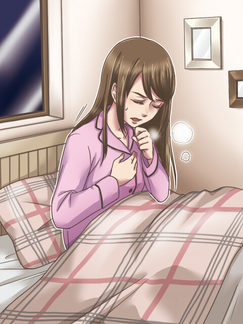 喘息発作で苦しむ女性